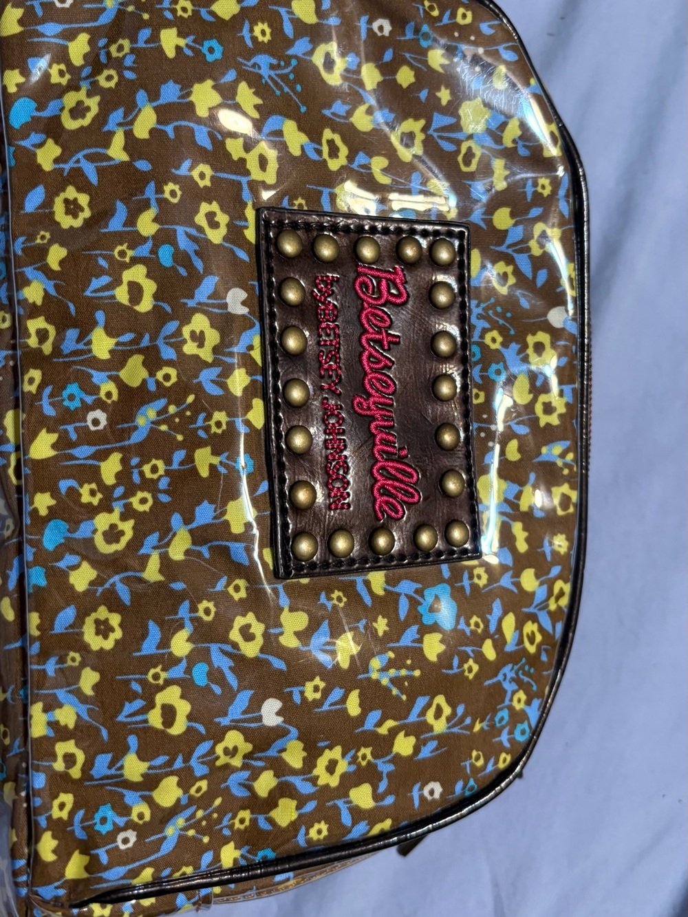 Betsey Johnson Brown Floral Coated Cosmetic Bag with Yellow & Blue Accents
